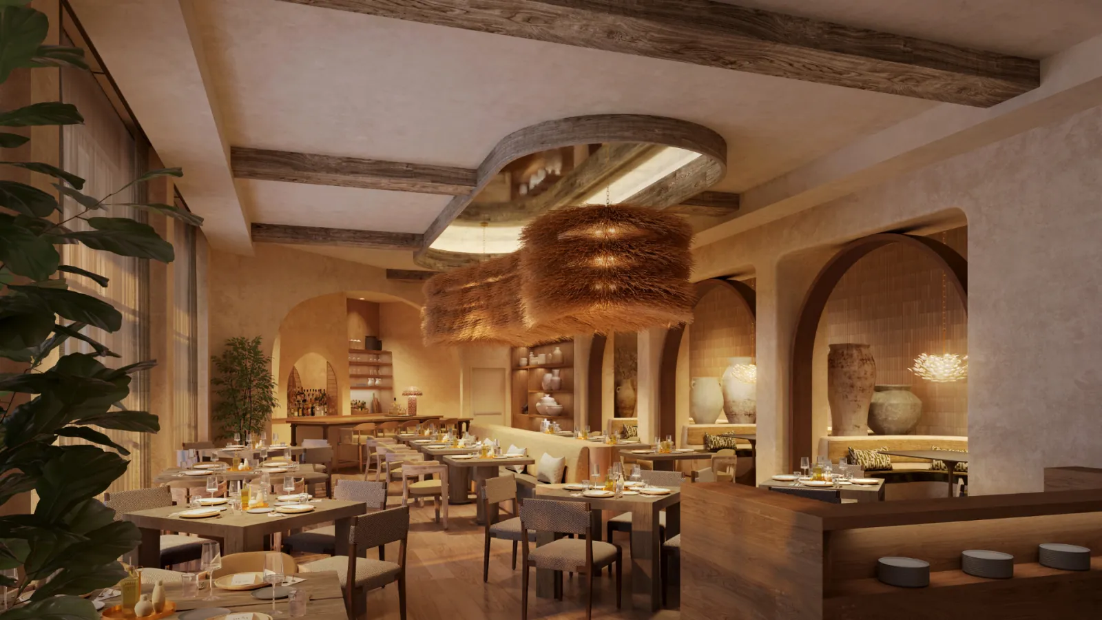 The Cozina restaurant with arched alcoves and a round chandelier