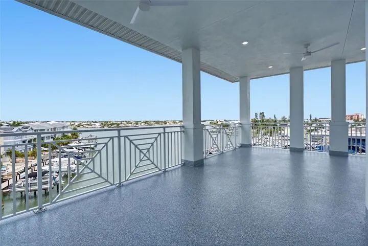 Wide covered balcony looking over the harbor and Boca Ciega Bay