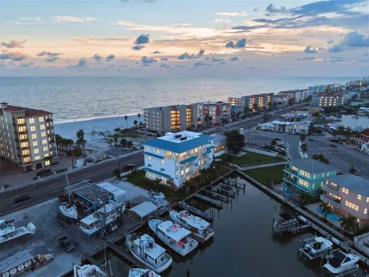 Aerial photo of the building and harbor at dusk